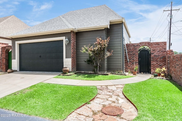 100 Serenity Sound Dr, Lafayette, LA 70506 - view of front of house with driveway, a garage, roof with shingles, and brick siding