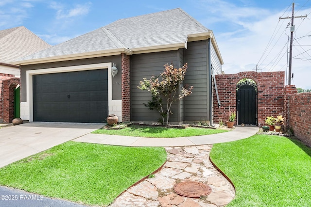100 Serenity Sound Dr, Lafayette, LA 70506 - view of front of house featuring concrete driveway, an attached garage, a shingled roof, and brick siding