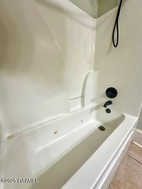 100 Serenity Sound Dr, Lafayette, LA 70506 - bathroom with tile patterned floors and shower / tub combination