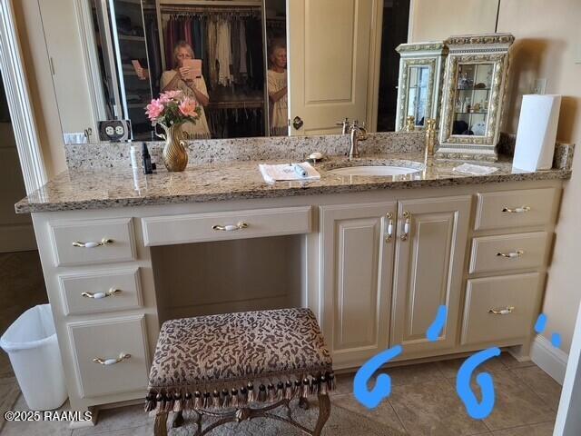 106 Princeton Woods Loop, Lafayette, LA 70508 - bathroom featuring vanity, tile patterned floors, and a spacious closet