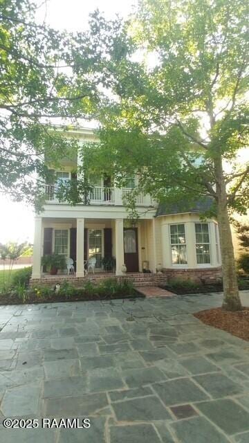 106 Princeton Woods Loop, Lafayette, LA 70508 - view of front of property with a balcony and a porch