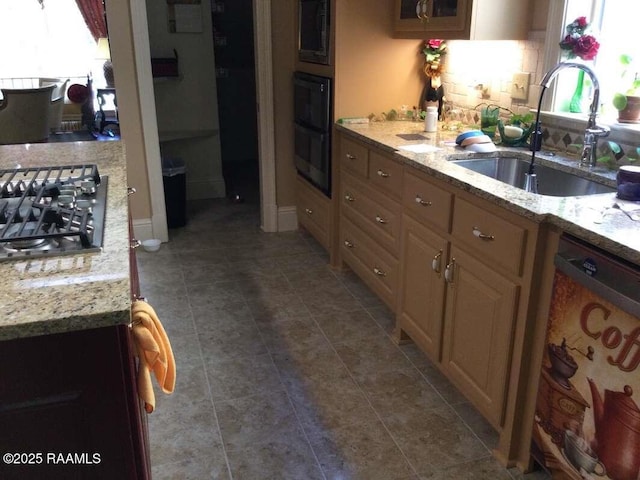 106 Princeton Woods Loop, Lafayette, LA 70508 - kitchen featuring dishwashing machine, stainless steel gas stovetop, light stone counters, dark tile patterned flooring, and cream cabinetry