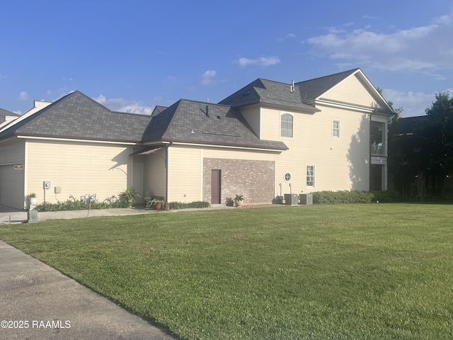 106 Princeton Woods Loop, Lafayette, LA 70508 - view of side of property with a yard, a garage, and roof with shingles