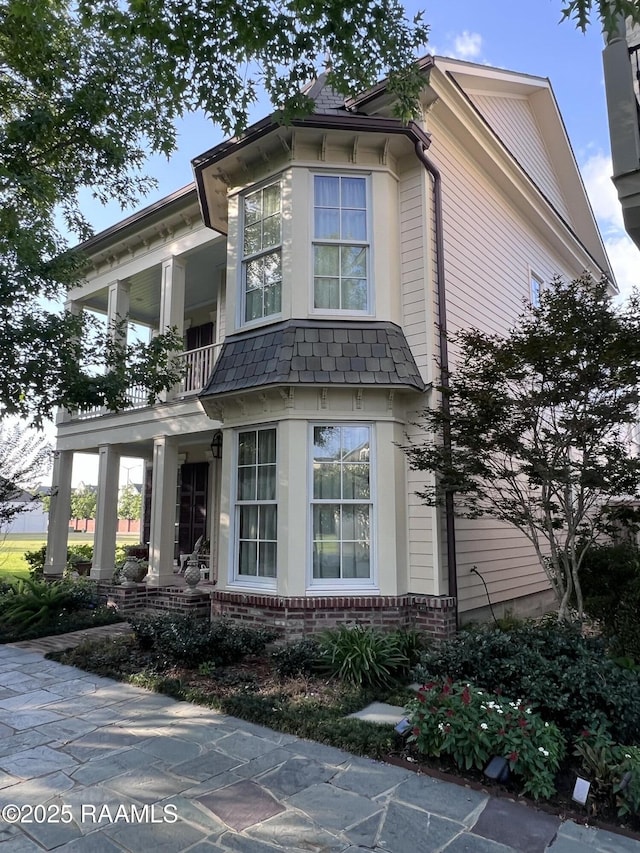 106 Princeton Woods Loop, Lafayette, LA 70508 - view of front of property with a balcony and brick siding