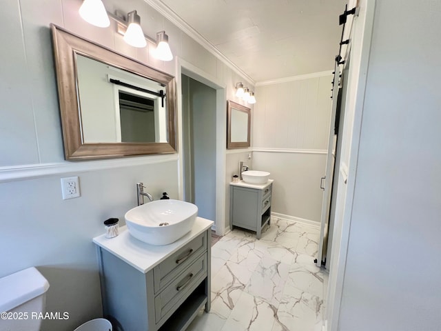 5501 Northside Rd, New Iberia, LA 70563 - bathroom featuring two vanities, marble look tiles, and ornamental molding