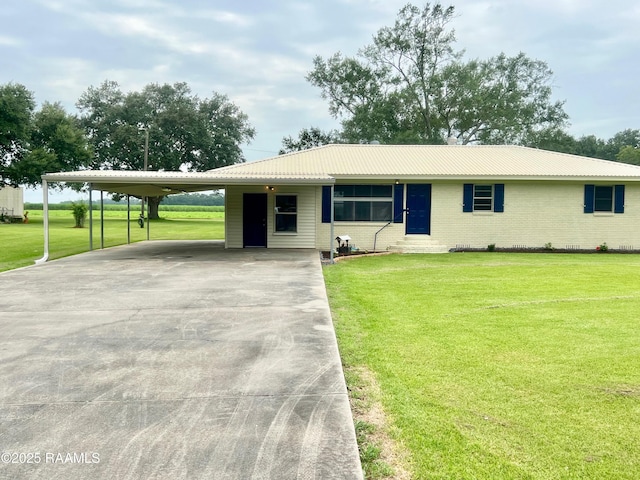 5501 Northside Rd, New Iberia, LA 70563 - single story home featuring a front lawn, brick siding, a carport, concrete driveway, and a metal roof