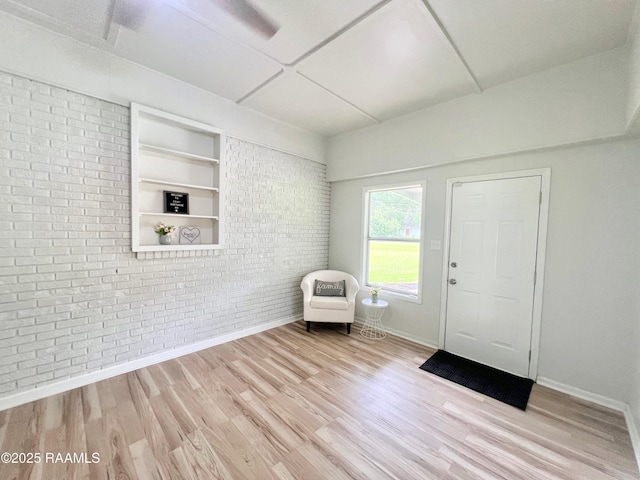 5501 Northside Rd, New Iberia, LA 70563 - foyer entrance featuring brick wall and wood finished floors