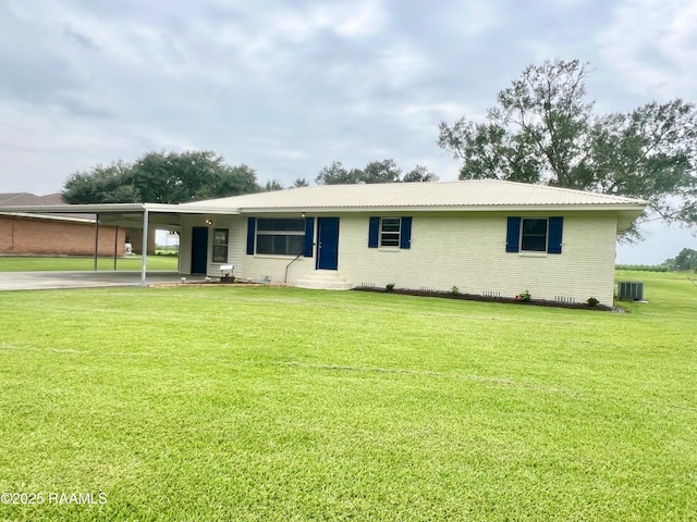 5501 Northside Rd, New Iberia, LA 70563 - ranch-style home with brick siding, a front yard, an attached carport, and driveway