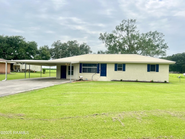 5501 Northside Rd, New Iberia, LA 70563 - ranch-style house featuring an attached carport, driveway, a front yard, and a metal roof