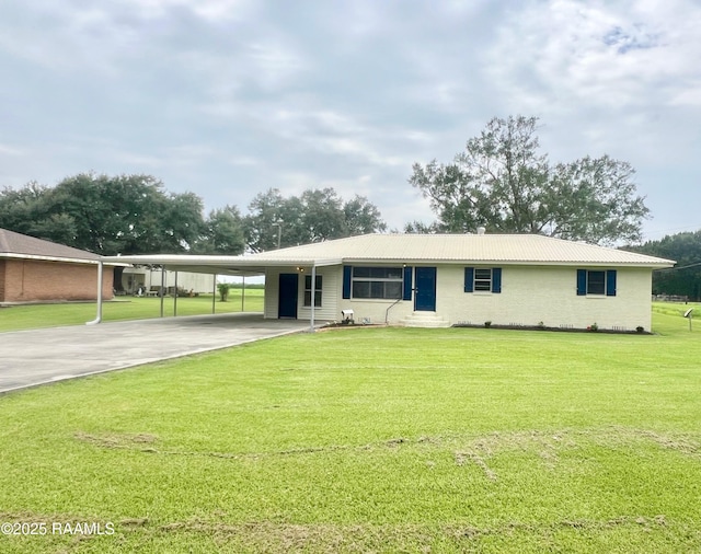 5501 Northside Rd, New Iberia, LA 70563 - view of front of house featuring driveway, an attached carport, a front yard, a metal roof, and entry steps