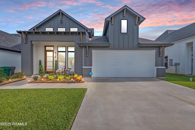 127 Lakes Edge Dr, Broussard, LA 70518 - modern farmhouse with board and batten siding, concrete driveway, a yard, and an attached garage