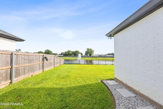 127 Lakes Edge Dr, Broussard, LA 70518 - fenced backyard with a water view