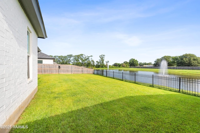 127 Lakes Edge Dr, Broussard, LA 70518 - fenced backyard featuring a water view