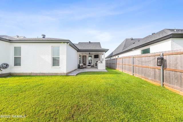 127 Lakes Edge Dr, Broussard, LA 70518 - rear view of property featuring ceiling fan, a patio, a fenced backyard, brick siding, and an outdoor living space