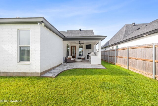127 Lakes Edge Dr, Broussard, LA 70518 - rear view of house with a ceiling fan, outdoor lounge area, a patio, and brick siding