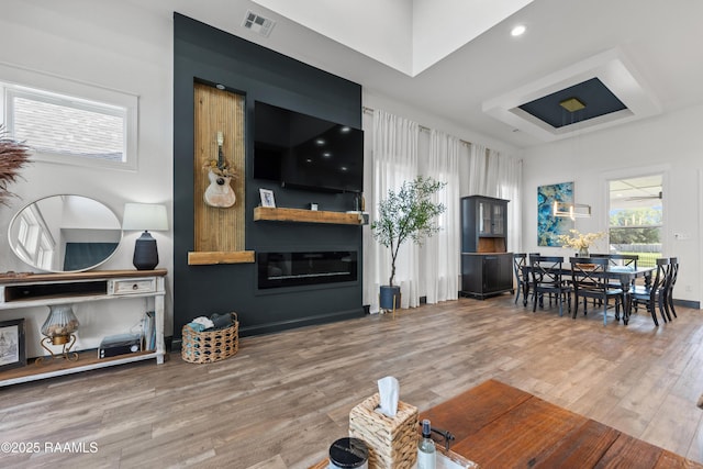 127 Lakes Edge Dr, Broussard, LA 70518 - living room with wood finished floors and a glass covered fireplace