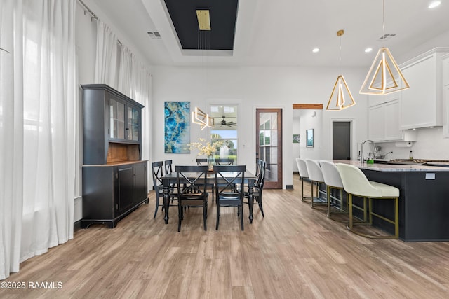 127 Lakes Edge Dr, Broussard, LA 70518 - dining room featuring light wood-style flooring, recessed lighting, and attic access