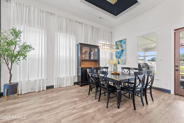 127 Lakes Edge Dr, Broussard, LA 70518 - dining space with light wood-style floors and a towering ceiling