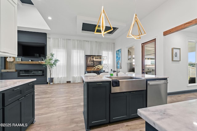 127 Lakes Edge Dr, Broussard, LA 70518 - kitchen with stainless steel dishwasher, pendant lighting, a kitchen island with sink, recessed lighting, and open floor plan