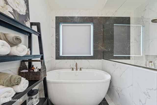 127 Lakes Edge Dr, Broussard, LA 70518 - full bathroom featuring a freestanding tub and tile walls