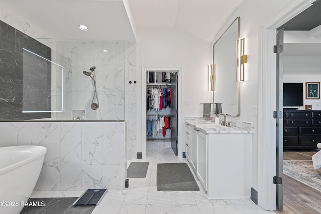 127 Lakes Edge Dr, Broussard, LA 70518 - full bathroom featuring vanity, a marble finish shower, marble finish flooring, a freestanding tub, and a walk in closet