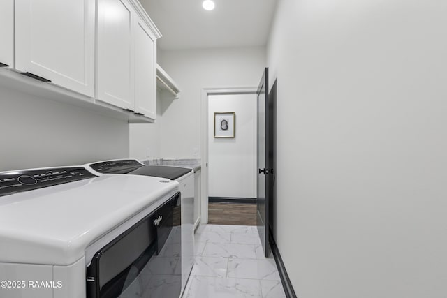 127 Lakes Edge Dr, Broussard, LA 70518 - laundry room featuring cabinet space, washer and dryer, and light marble finish flooring