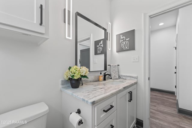 127 Lakes Edge Dr, Broussard, LA 70518 - bathroom with vanity, wood finished floors, and recessed lighting