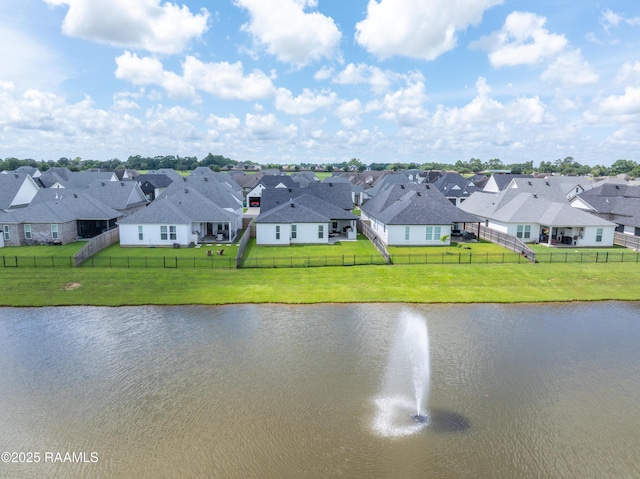 127 Lakes Edge Dr, Broussard, LA 70518 - water view with nearby suburban area and a fenced backyard