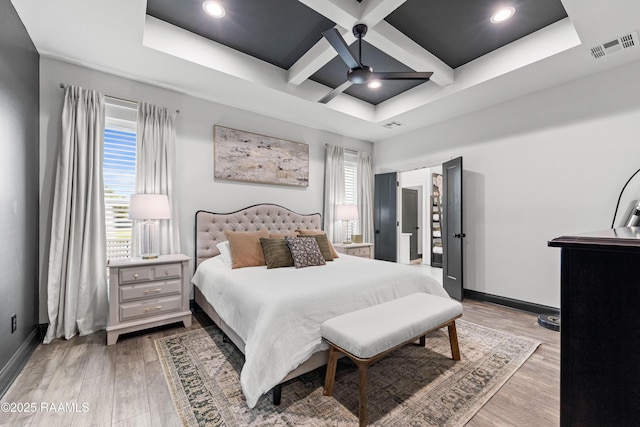 127 Lakes Edge Dr, Broussard, LA 70518 - bedroom featuring multiple windows, light wood finished floors, coffered ceiling, beamed ceiling, and ceiling fan