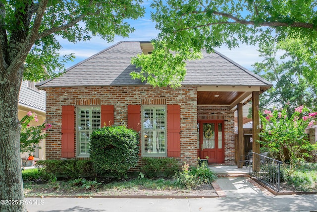 302 River Ranch Blvd, Lafayette, LA 70508 - view of front facade featuring roof with shingles, brick siding, and covered porch