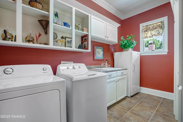 302 River Ranch Blvd, Lafayette, LA 70508 - washroom featuring cabinet space, ornamental molding, and washing machine and clothes dryer
