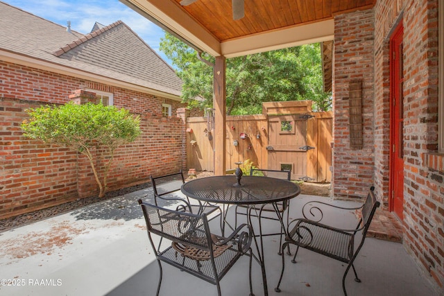 302 River Ranch Blvd, Lafayette, LA 70508 - view of patio / terrace featuring outdoor dining area, a ceiling fan, and a gate