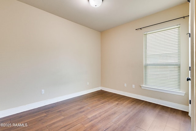 213 Hidden Ridge Dr, Lafayette, LA 70507 - spare room featuring baseboards and wood finished floors