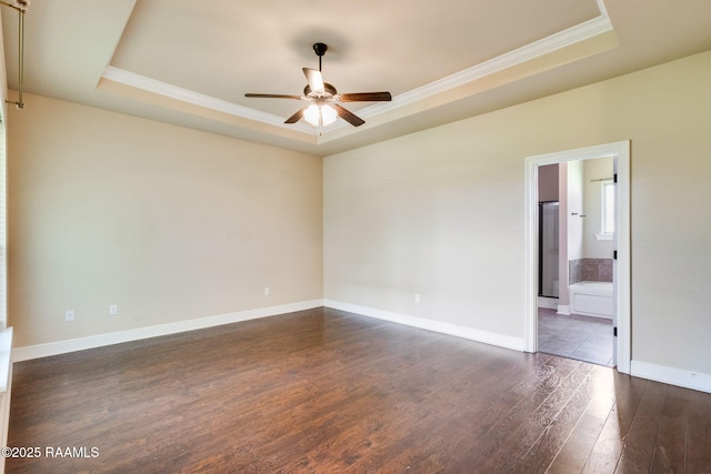 213 Hidden Ridge Dr, Lafayette, LA 70507 - unfurnished room featuring a raised ceiling, a ceiling fan, crown molding, and dark wood finished floors