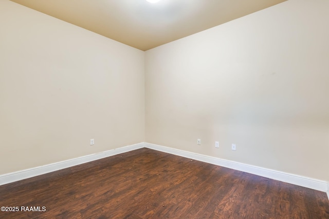 213 Hidden Ridge Dr, Lafayette, LA 70507 - spare room with baseboards and dark wood finished floors