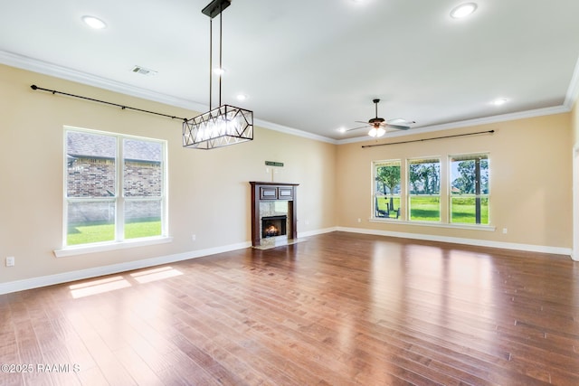 213 Hidden Ridge Dr, Lafayette, LA 70507 - unfurnished living room featuring ceiling fan, recessed lighting, crown molding, a premium fireplace, and wood finished floors