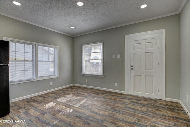 807/809 E Vermilion St, Abbeville, LA 70510 - spare room featuring ornamental molding, wood finished floors, a textured ceiling, and recessed lighting