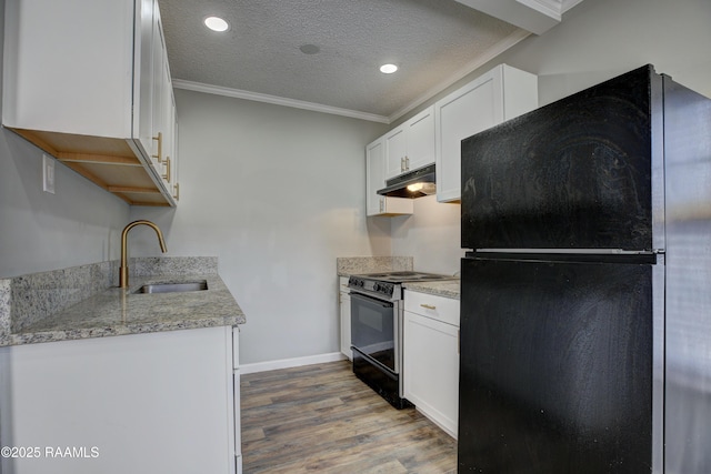 807/809 E Vermilion St, Abbeville, LA 70510 - kitchen featuring black appliances, under cabinet range hood, wood finished floors, a textured ceiling, and ornamental molding