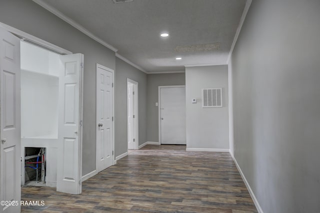 807/809 E Vermilion St, Abbeville, LA 70510 - hallway with ornamental molding, dark wood-style flooring, and recessed lighting