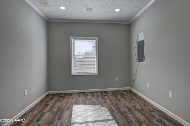807/809 E Vermilion St, Abbeville, LA 70510 - spare room featuring crown molding, a textured ceiling, wood finished floors, recessed lighting, and electric panel