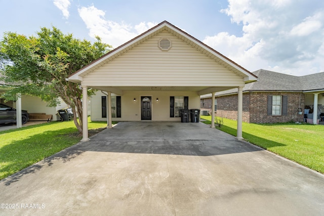 1518 S Patout St, New Iberia, LA 70560 - view of front facade with driveway, a carport, and a front yard