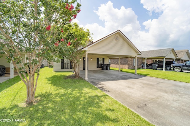 1518 S Patout St, New Iberia, LA 70560 - view of front of property featuring driveway, a front yard, and a carport