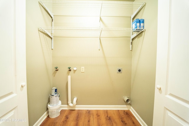 1518 S Patout St, New Iberia, LA 70560 - laundry room with electric dryer hookup and wood finished floors