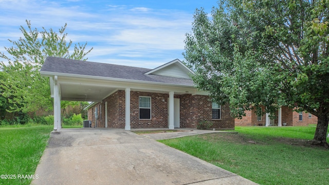 1005 W End Dr, New Iberia, LA 70560 - view of front facade with brick siding, a front yard, concrete driveway, and roof with shingles
