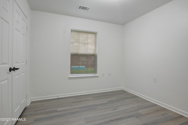 1005 W End Dr, New Iberia, LA 70560 - unfurnished bedroom featuring wood finished floors and a closet