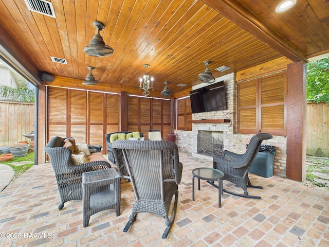 109 Canterbury Rd, Lafayette, LA 70503 - view of patio featuring ceiling fan and an outdoor living space with a fireplace