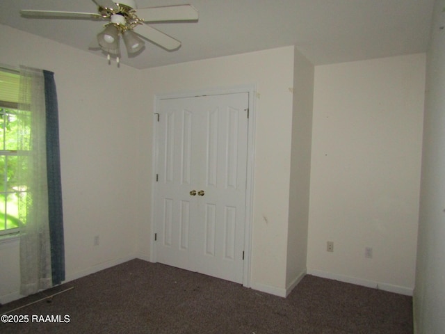 401 Aimee Dr, Carencro, LA 70520 - unfurnished bedroom with multiple windows, a closet, carpet, and ceiling fan