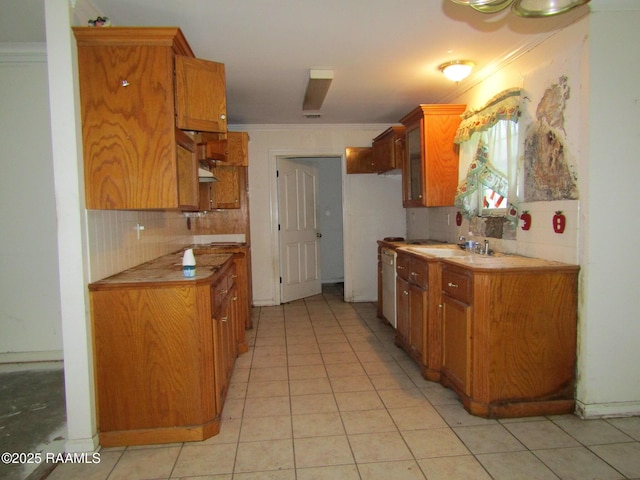 401 Aimee Dr, Carencro, LA 70520 - kitchen featuring ornamental molding, decorative backsplash, light tile patterned floors, and brown cabinets