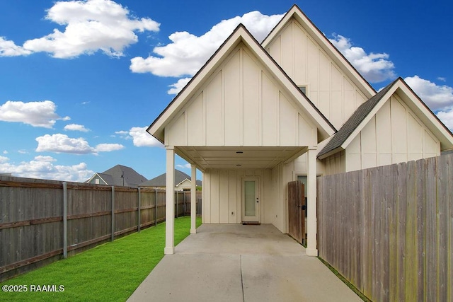 115 Sandstone Ave, Scott, LA 70583 - fenced backyard featuring a patio and a detached carport