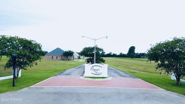 11512 Baker Senior Dr, Abbeville, LA 70510 - view of asphalt road with street lighting